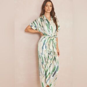 ENTRO Printed satin button down midi dress featuring self-tie at waist. Lined